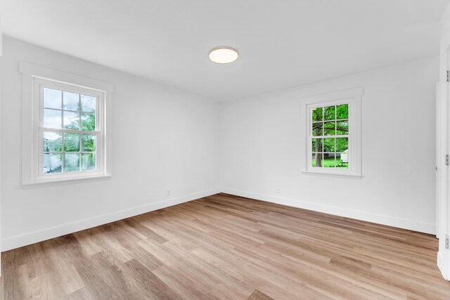 1107 E Mccracken Rd, Ozark, MO 65721 - empty room with light wood-style flooring and baseboards