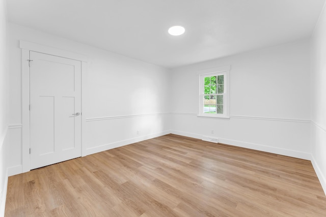 1107 E Mccracken Rd, Ozark, MO 65721 - unfurnished room featuring visible vents, light wood-style flooring, and baseboards