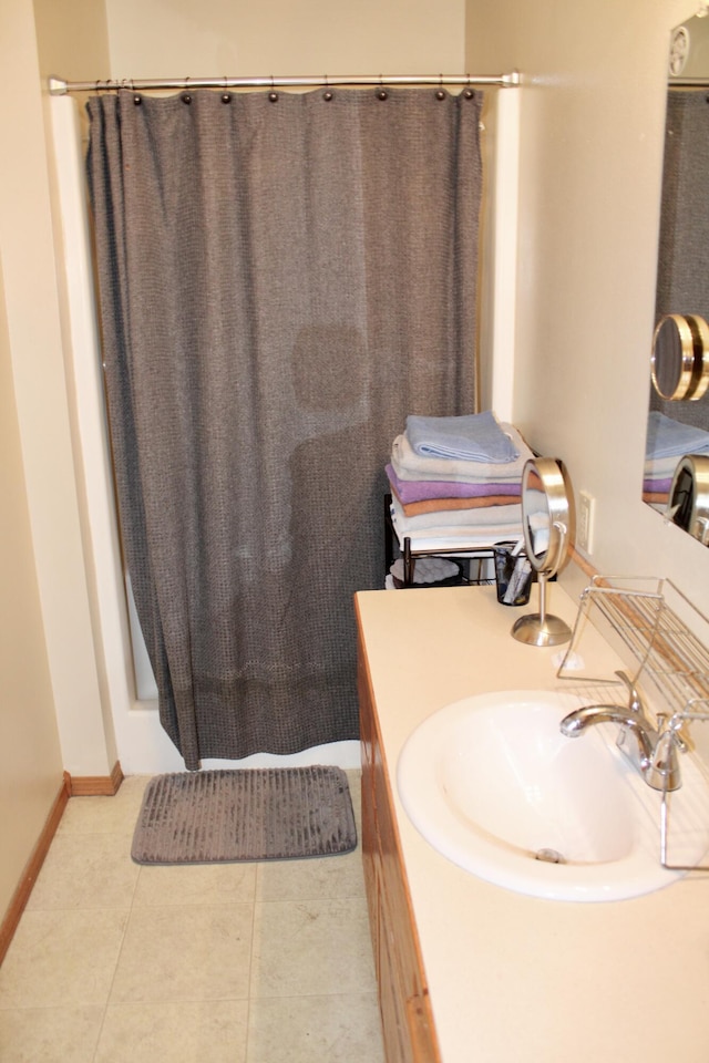 112 S Winfield, Joplin, MO 64801 - bathroom featuring a shower with curtain, baseboards, tile patterned flooring, and vanity