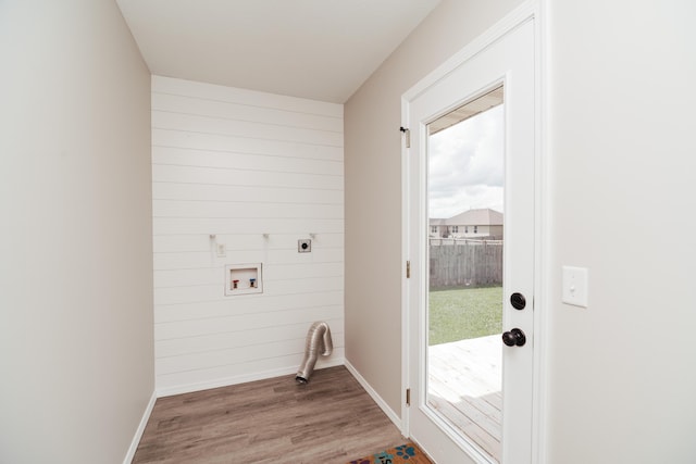 washroom featuring laundry area, baseboards, hookup for a washing machine, electric dryer hookup, and light wood finished floors