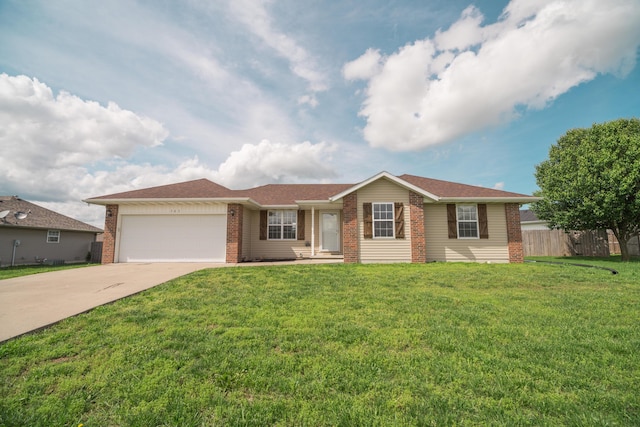 ranch-style house with fence, a front yard, brick siding, an attached garage, and driveway