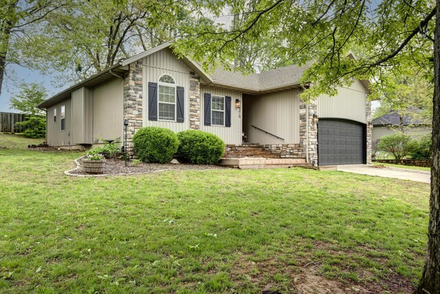 1376 N 14th St, Ozark, MO 65721 - ranch-style house with a front yard, an attached garage, driveway, and stone siding