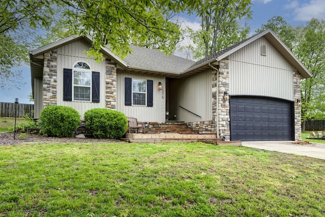 1376 N 14th St, Ozark, MO 65721 - single story home with driveway, a front lawn, stone siding, and a garage