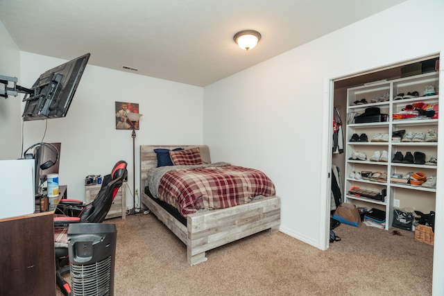 bedroom featuring carpet floors, baseboards, and visible vents