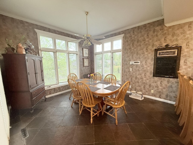 dining space featuring crown molding, a ceiling fan, wallpapered walls, and baseboards