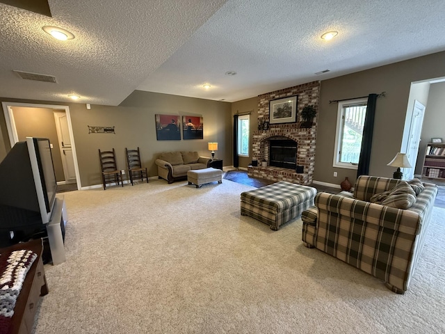 carpeted living room with a textured ceiling, visible vents, baseboards, and a healthy amount of sunlight