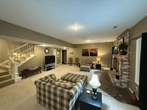 carpeted living area with stairs and a fireplace