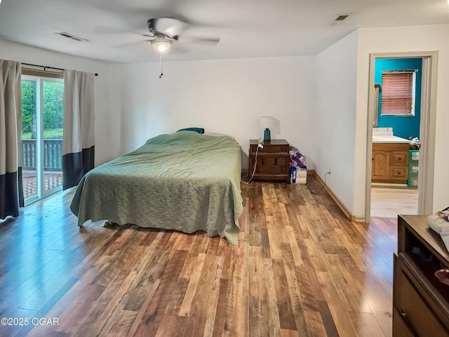 bedroom with visible vents, access to exterior, and light wood-style floors