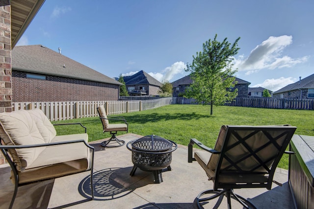 view of patio / terrace featuring a fenced backyard and an outdoor fire pit
