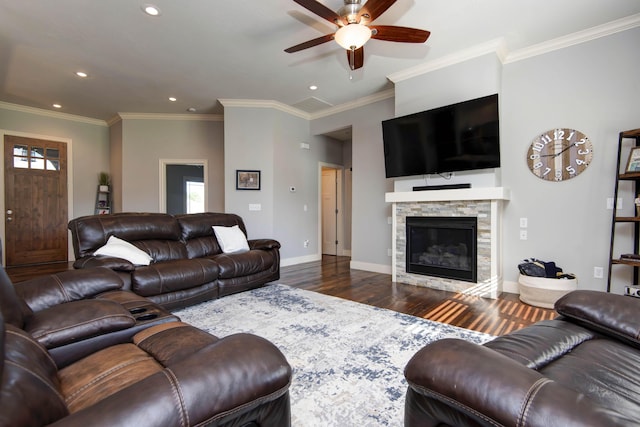 living room with baseboards, a stone fireplace, ceiling fan, dark wood-style floors, and recessed lighting
