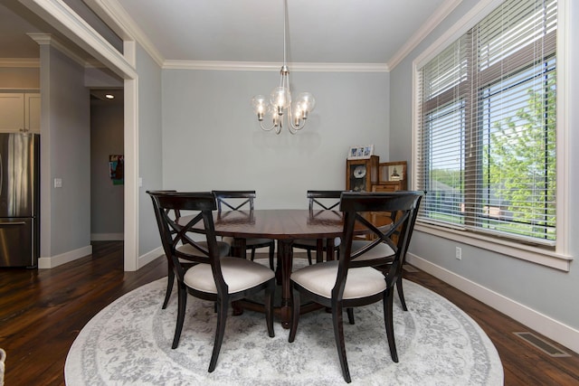 dining space featuring baseboards, visible vents, ornamental molding, and a healthy amount of sunlight