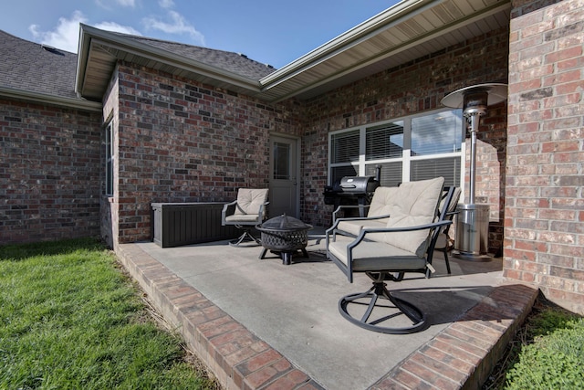 view of patio / terrace with a fire pit and area for grilling