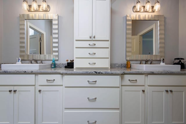 full bathroom featuring vanity and a chandelier
