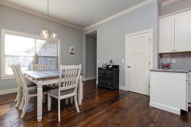 dining space featuring crown molding, a notable chandelier, dark wood-style floors, and a healthy amount of sunlight