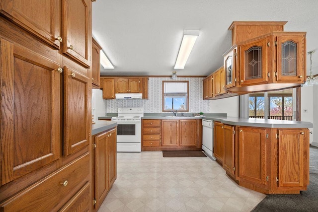 26929 Cordwood Ridge Dr, Shell Knob, MO 65747 - kitchen featuring a sink, white appliances, brown cabinetry, a peninsula, and under cabinet range hood