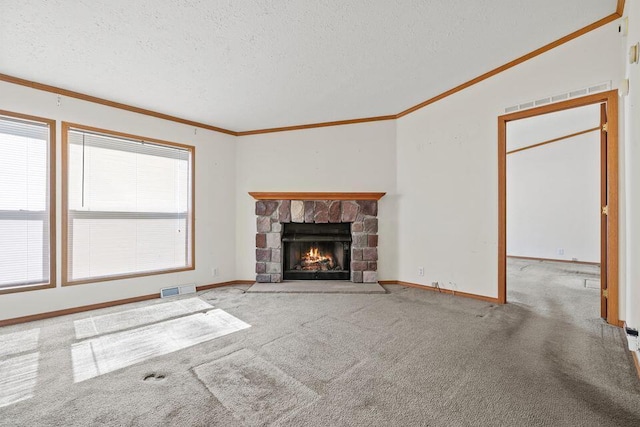 26929 Cordwood Ridge Dr, Shell Knob, MO 65747 - unfurnished living room with visible vents, crown molding, carpet floors, a stone fireplace, and a textured ceiling
