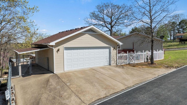 26929 Cordwood Ridge Dr, Shell Knob, MO 65747 - view of side of property with concrete driveway, an attached garage, fence, and a gate