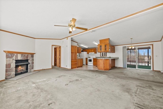 26929 Cordwood Ridge Dr, Shell Knob, MO 65747 - unfurnished living room featuring baseboards, ornamental molding, lofted ceiling, and a fireplace