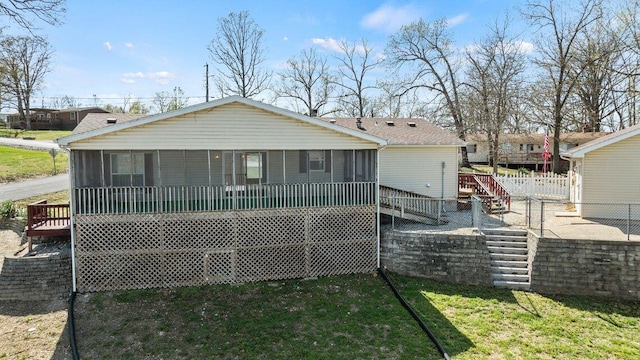 26929 Cordwood Ridge Dr, Shell Knob, MO 65747 - back of property with a lawn, a deck, stairs, and a sunroom