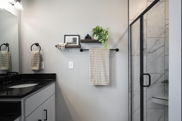 bathroom with vanity and a shower stall