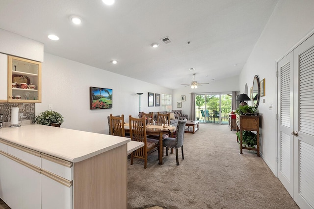 dining room featuring visible vents, ceiling fan, light colored carpet, recessed lighting, and vaulted ceiling