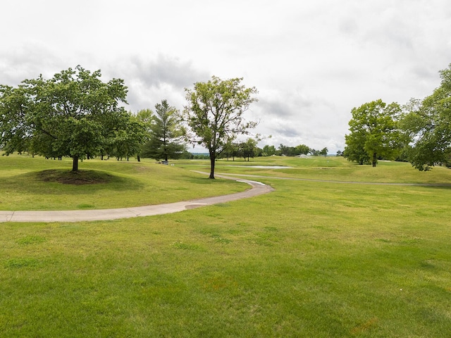 view of property's community with a lawn
