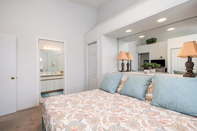 bedroom with carpet floors, recessed lighting, and ensuite bath