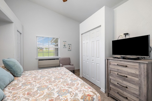 carpeted bedroom with a closet, an AC wall unit, and high vaulted ceiling
