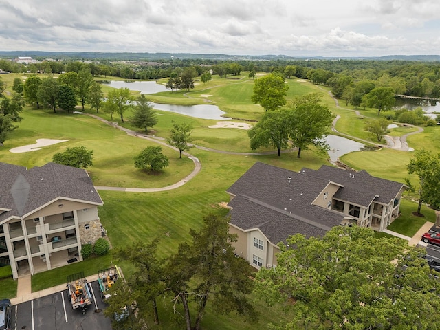 bird's eye view with a water view and golf course view