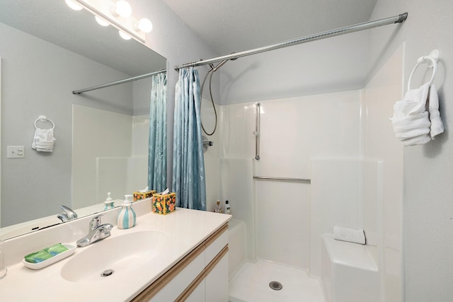 bathroom with vanity and curtained shower