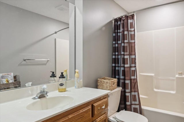 full bathroom featuring vanity, toilet, and shower / bath combination with curtain