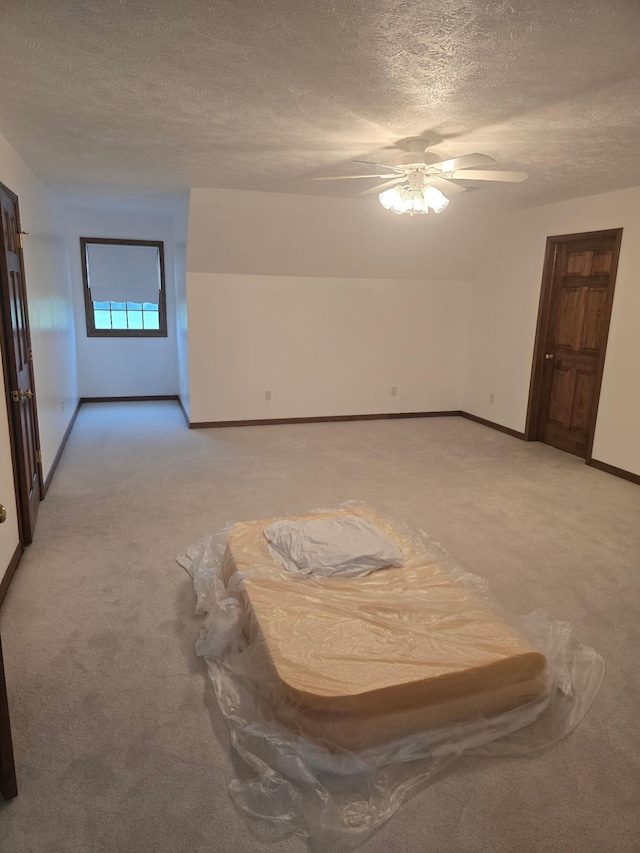 3725 E Shelby Rd, Springfield, MO 65803 - spare room featuring light carpet, a textured ceiling, a ceiling fan, and baseboards