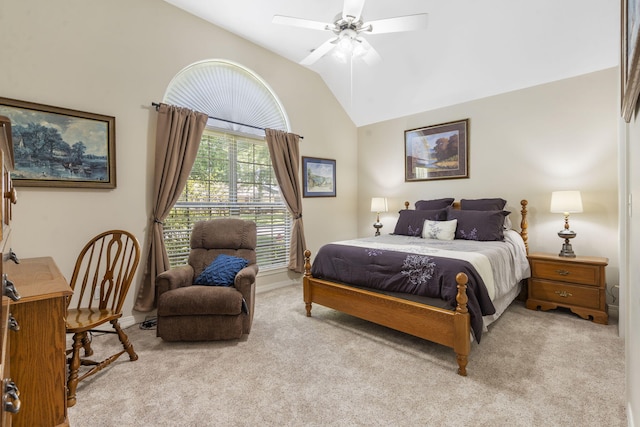 bedroom featuring light colored carpet, baseboards, ceiling fan, and lofted ceiling