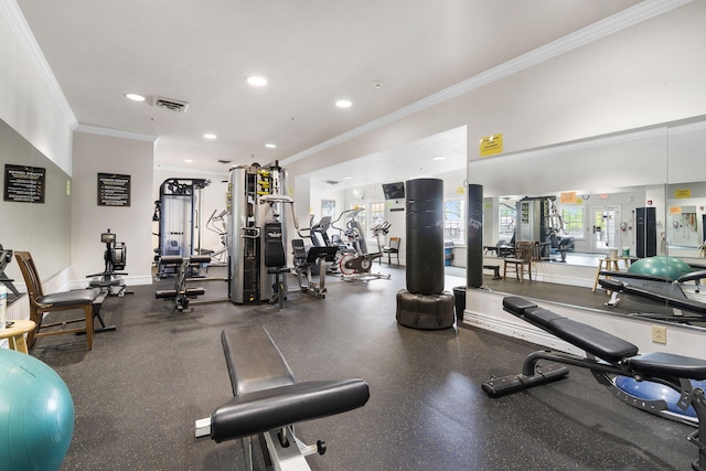 workout area featuring visible vents, ornamental molding, and recessed lighting