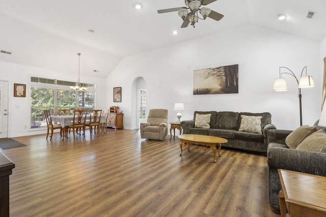 living area with arched walkways, ceiling fan with notable chandelier, baseboards, wood finished floors, and visible vents