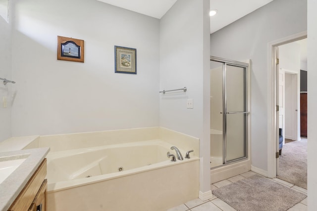 bathroom with tile patterned flooring, vanity, a whirlpool tub, baseboards, and a shower stall