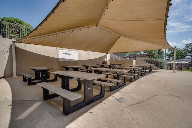 view of patio / terrace featuring fence and outdoor dining area
