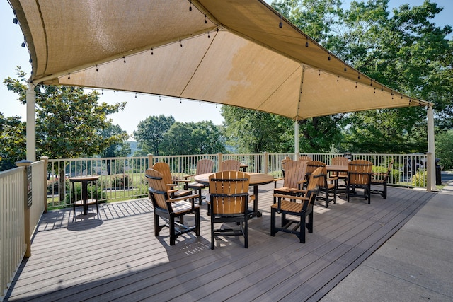 deck with outdoor dining space