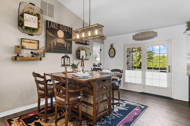 dining space featuring baseboards, dark wood-style floors, and visible vents