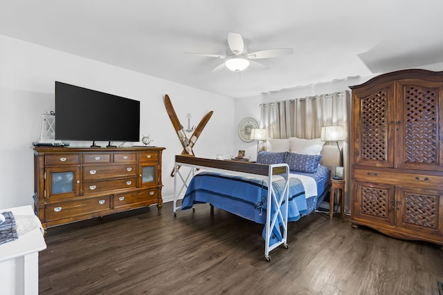 bedroom with ceiling fan and dark wood-type flooring