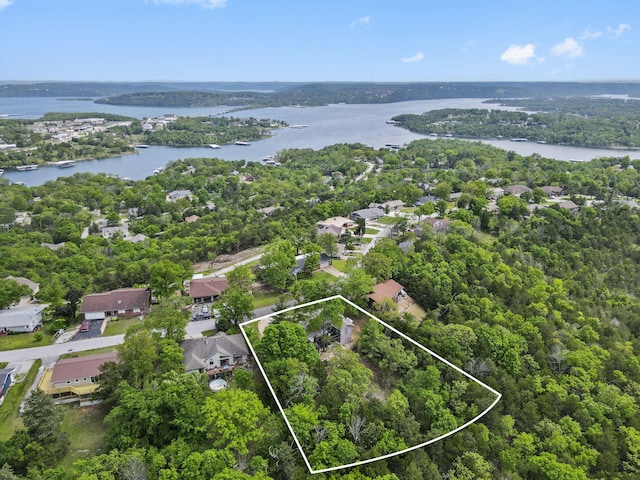 birds eye view of property featuring a water view and a residential view