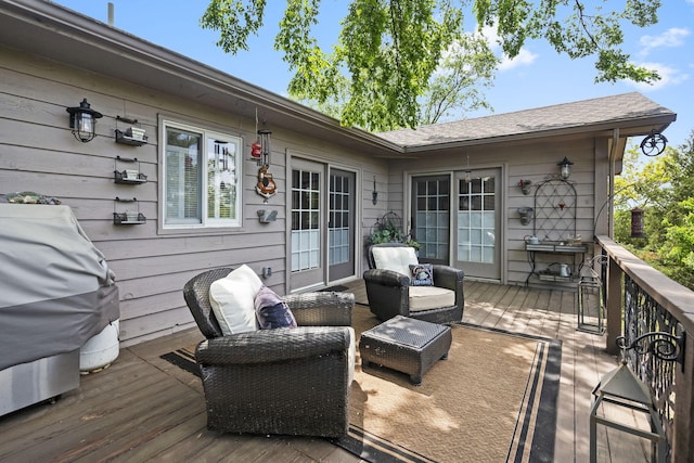 wooden deck featuring grilling area