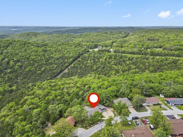 drone / aerial view with a view of trees