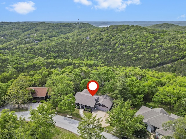 drone / aerial view featuring a view of trees
