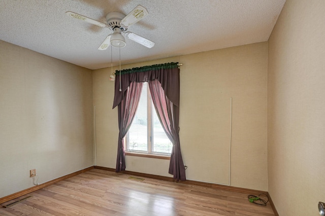 3623 Ridge Dr, Joplin, MO 64801 - spare room featuring baseboards, a textured ceiling, light wood finished floors, and a ceiling fan