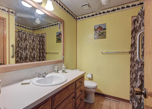 3623 Ridge Dr, Joplin, MO 64801 - full bath with vanity, toilet, wood finished floors, and visible vents