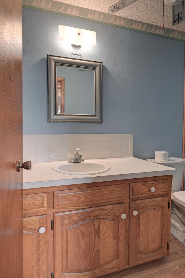 3623 Ridge Dr, Joplin, MO 64801 - bathroom with toilet, wood finished floors, and vanity