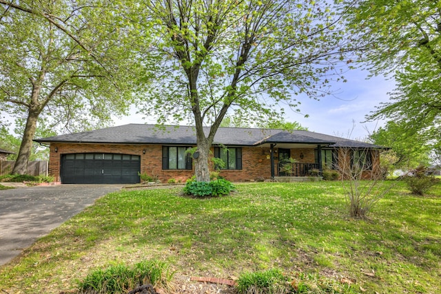3623 Ridge Dr, Joplin, MO 64801 - single story home with fence, brick siding, a garage, a front yard, and driveway