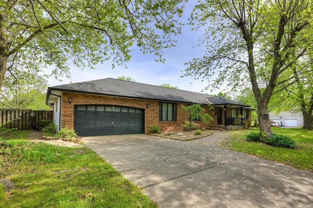 3623 Ridge Dr, Joplin, MO 64801 - single story home with a garage, fence, concrete driveway, and brick siding