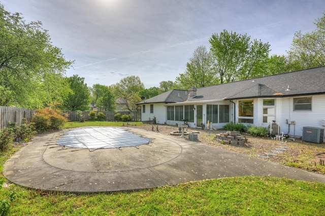 3623 Ridge Dr, Joplin, MO 64801 - view of pool featuring cooling unit, a patio, a fenced backyard, a sunroom, and a fenced in pool